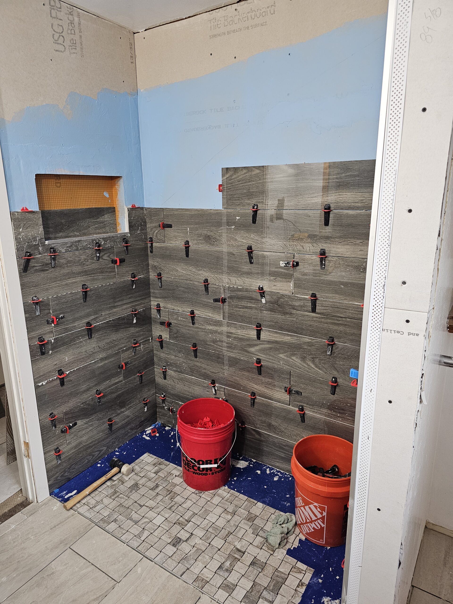 tiling shower walls after water proofing